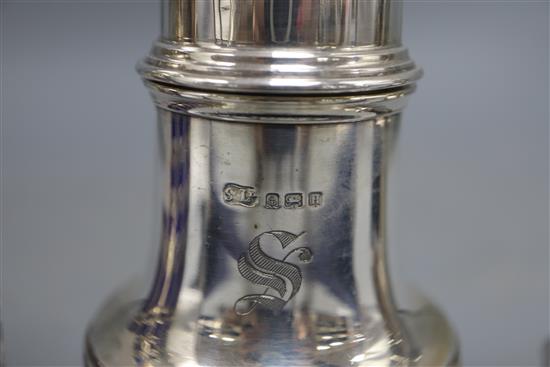 A late Victorian silver lighthouse sugar caster, with blue glass liner, London, 1900, 18.8cm and two later silver sugar casters,